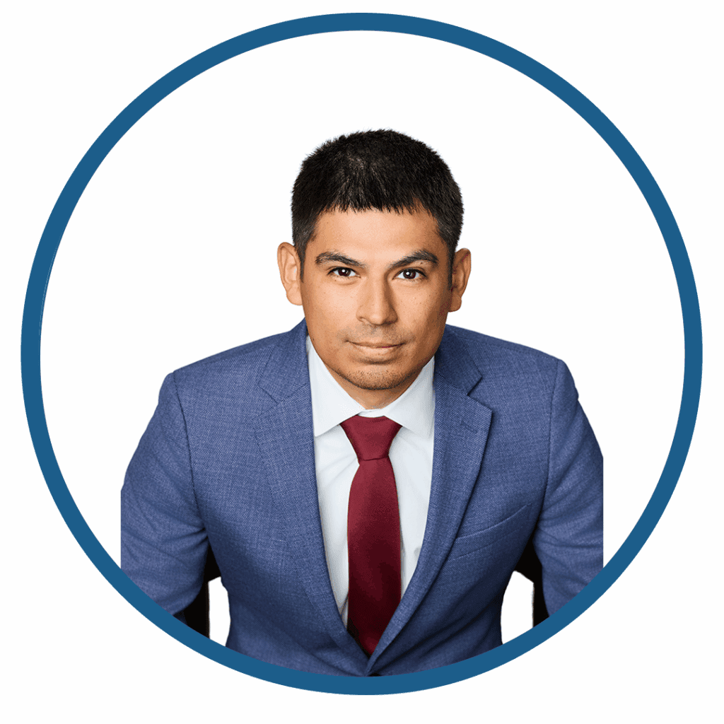Man in blue suit with red tie.