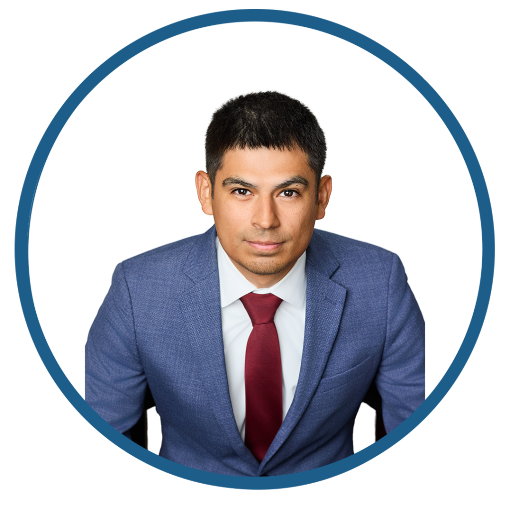 Professional man in blue suit with red tie against white background.