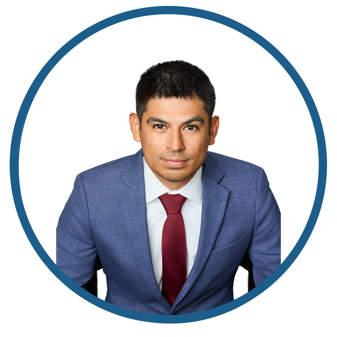 Professional man in blue suit with red tie against white background.