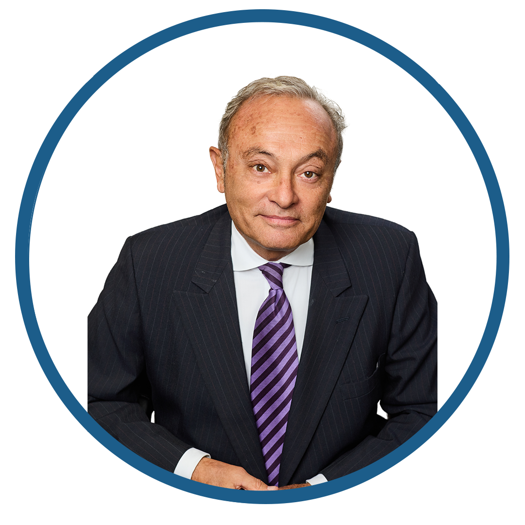 Professional man in a suit and striped tie posing with a confident expression.